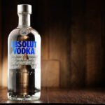 Poznan, Poland - June 22, 2016: Absolut Vodka is a brand of vodka, produced near Ahus, in Sweden. Owned by French group Pernod Ricard it is one of the largest brand of alcoholic spirits in the world.