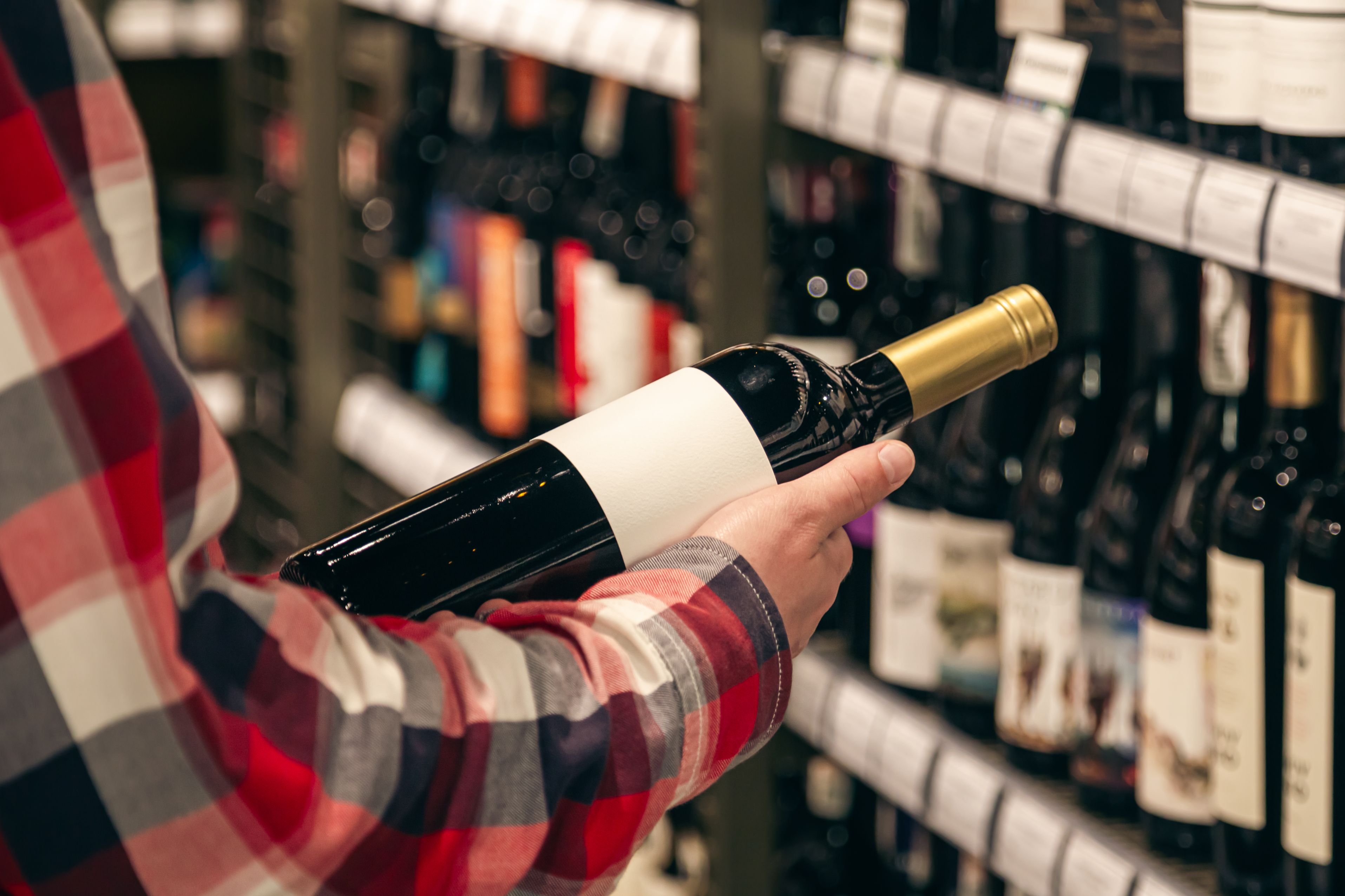 male-customer-holding-bottle-red-wine-close-up (1)